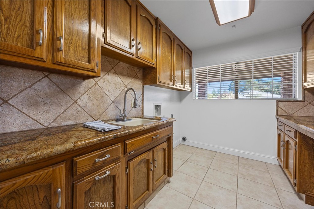 11717 Old Town Road Bakersfield, CA 93312 - Photo 49 of 61 a kitchen with stainless steel appliances granite countertop a stove and a sink
