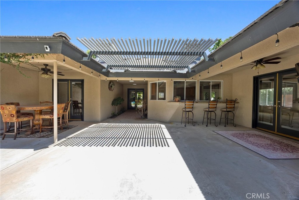 11717 Old Town Road Bakersfield, CA 93312 - Photo 51 of 61 a view of a livingroom with a patio and wooden fence