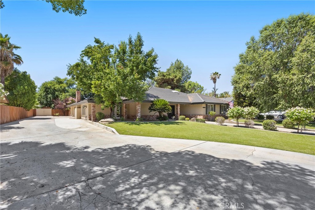 11717 Old Town Road Bakersfield, CA 93312 - Photo 10 of 61 a view of a house with a yard and tree s