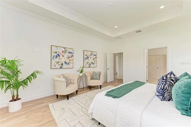 a kitchen with stainless steel appliances granite countertop table chairs and a refrigerator