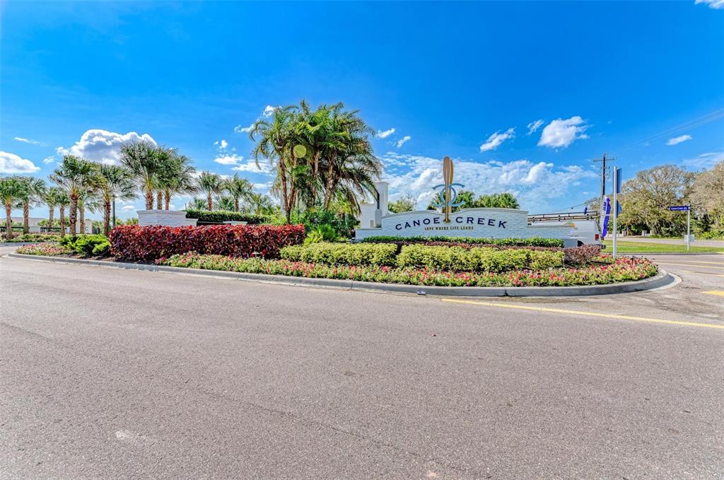14359 Skipping Stone Loop Parrish, FL 34219 - Photo 52 of 71 a view of a street with a building in the background