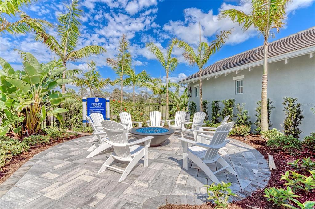14359 Skipping Stone Loop Parrish, FL 34219 - Photo 60 of 71 a view of a patio with table and chairs and potted plants