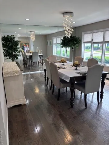 a view of a dining room with furniture and window