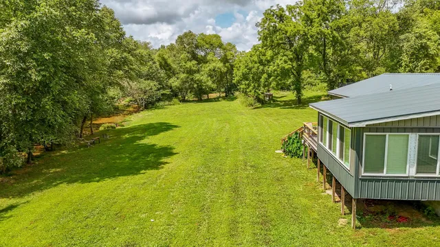 a balcony with yard and green space