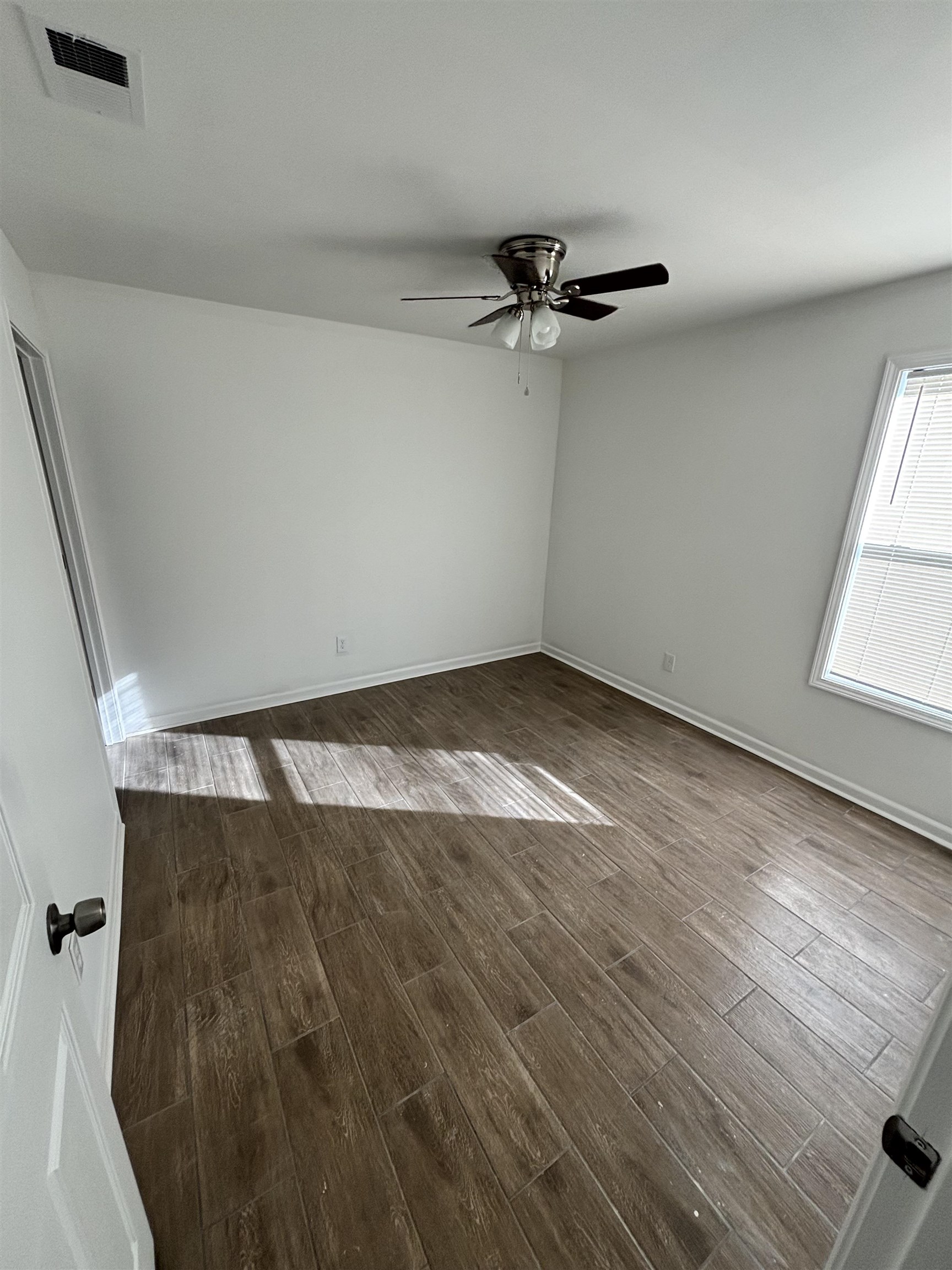 589 Gilleas Road Memphis, TN 38109 - Photo 4 of 6 wooden floor in an empty room