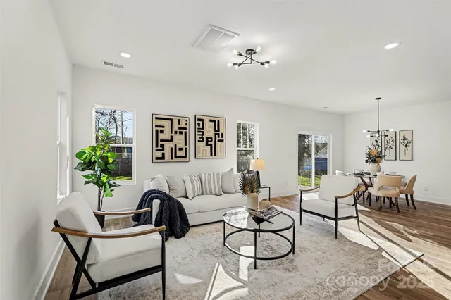 a view of a workspace with furniture and a potted plant