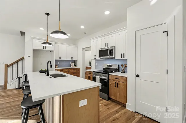 a close view of dining table with washer and dryer