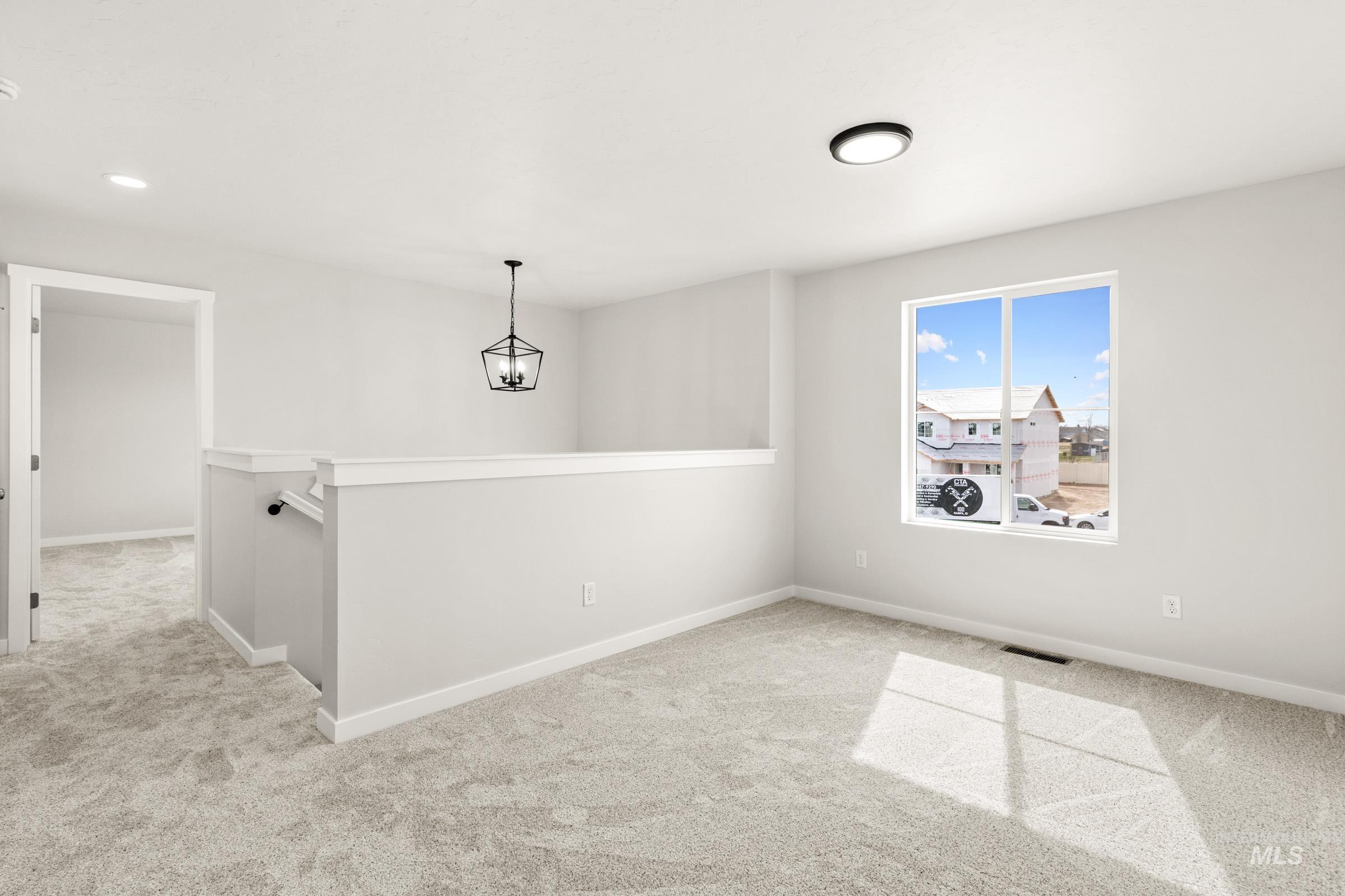 13716 Redway Court Caldwell, ID 83607 - Photo 14 of 18 Unfurnished room with light colored carpet