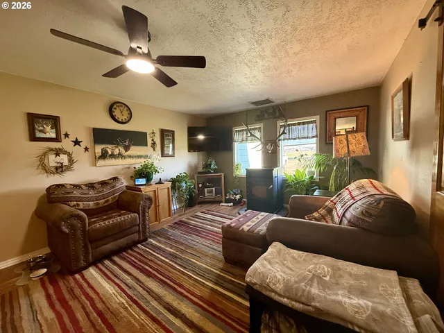 a living room with furniture or couch and a flat screen tv