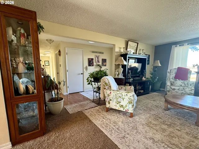 a bathroom with a glass shower door and a glass door
