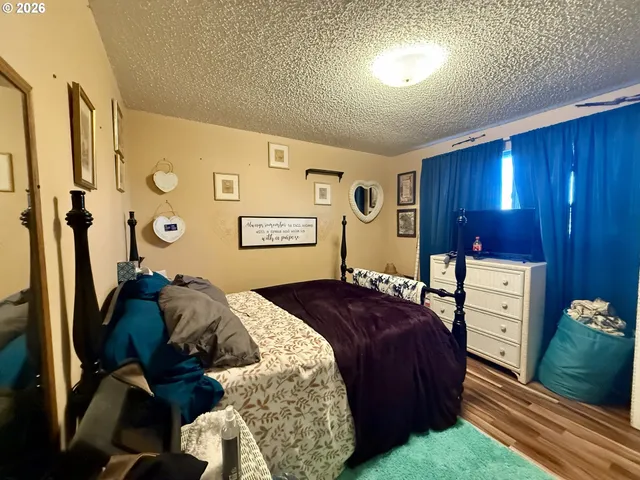 a bed room with a bed and a lamp