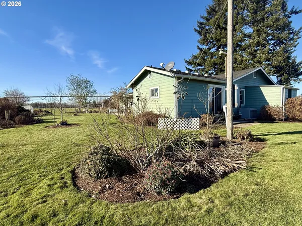 a house view with a sitting space and garden