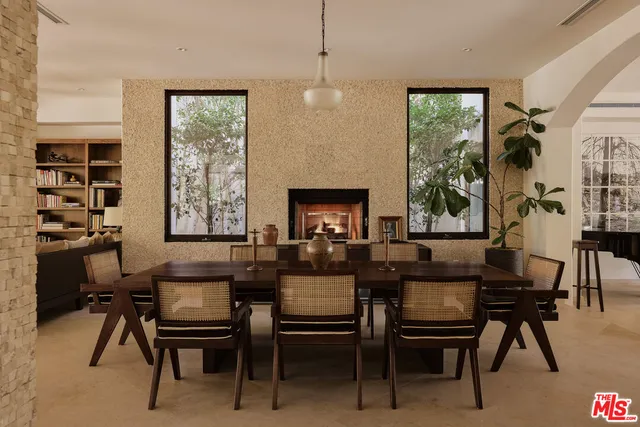 a dining room with furniture and window