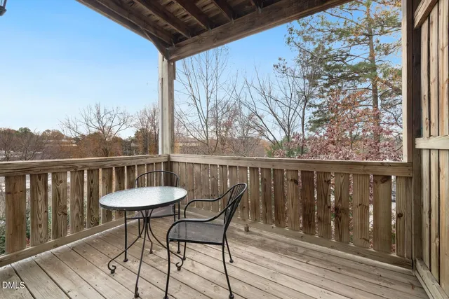 a view of a wooden door and a window