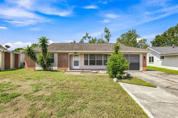 front view of a house with a yard