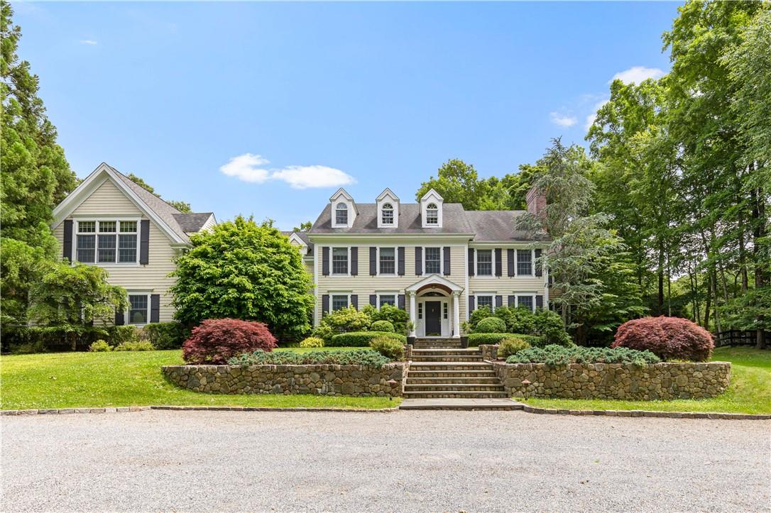 68 Dann Farm Road Pound Ridge, NY 10576 - Photo 1 of 1 a front view of a house with a yard and garage