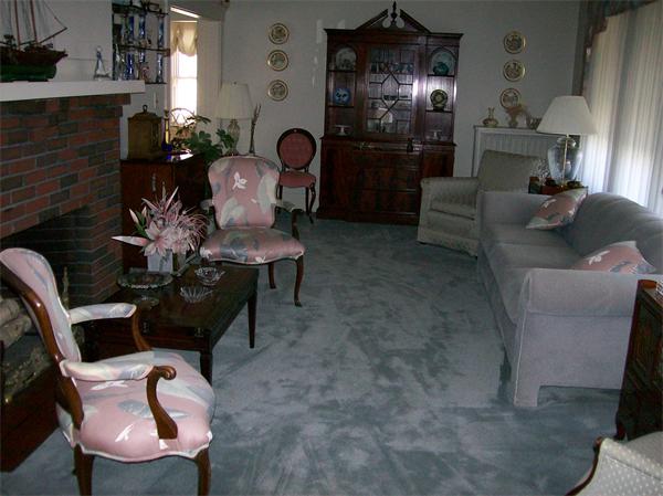 3 Pilgrim Road Marblehead, MA 01945 - Photo 4 of 6 a living room with furniture and a fireplace