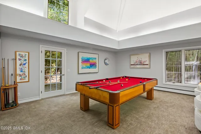 a spacious bedroom with a bed and window