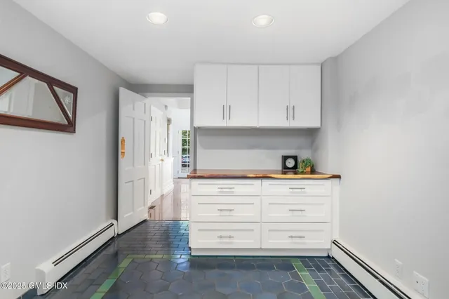 a kitchen with stainless steel appliances a stove and cabinets