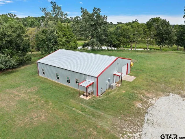 an aerial view of a house having yard