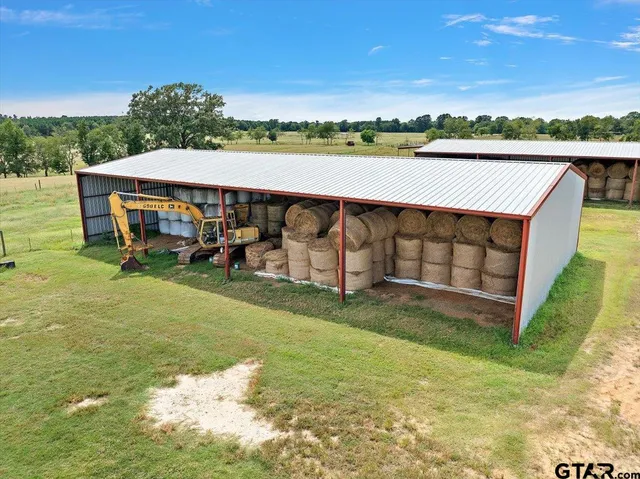 an outdoor view of a lake with a big yard
