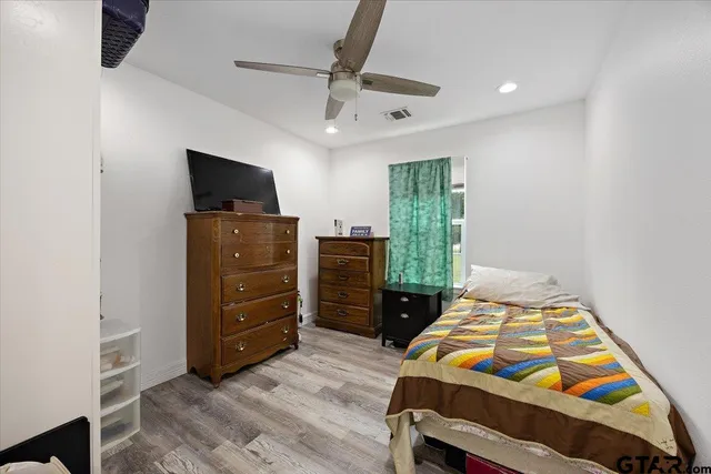 a bedroom with a bed and furniture