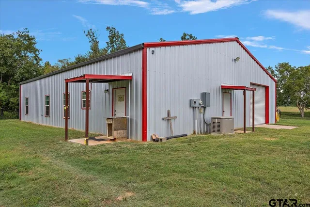 a view of a house with a backyard