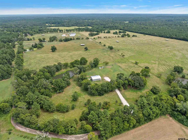 a view of a lake with a yard