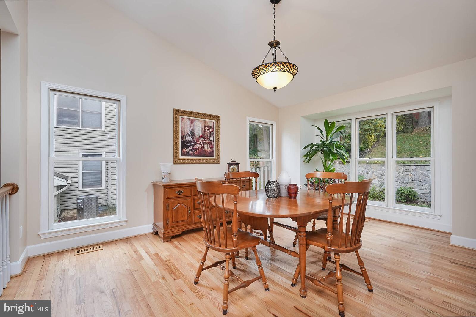 9505 Columbia Boulevard Silver Spring, MD 20910 - Photo 11 of 55 a view of a dining room with furniture window and wooden floor