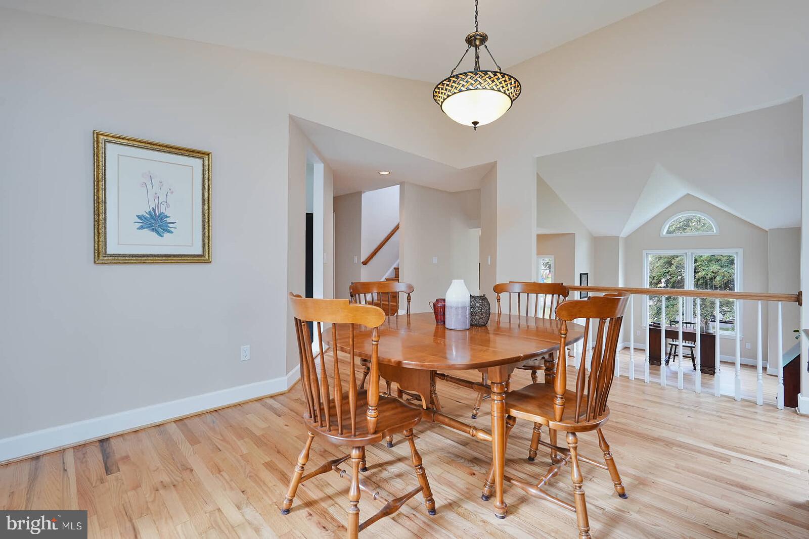 9505 Columbia Boulevard Silver Spring, MD 20910 - Photo 12 of 55 a view of a dining room with furniture and wooden floor