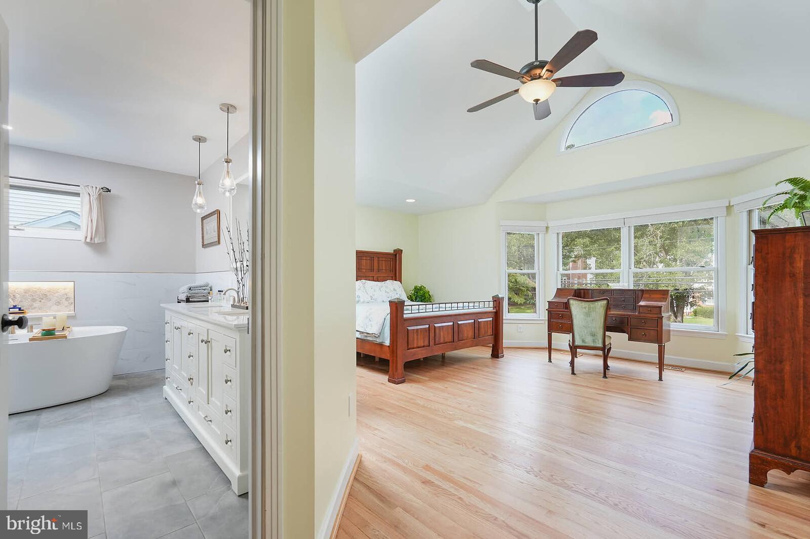 9505 Columbia Boulevard Silver Spring, MD 20910 - Photo 15 of 55 a view of a livingroom with furniture a ceiling fan and wooden floor