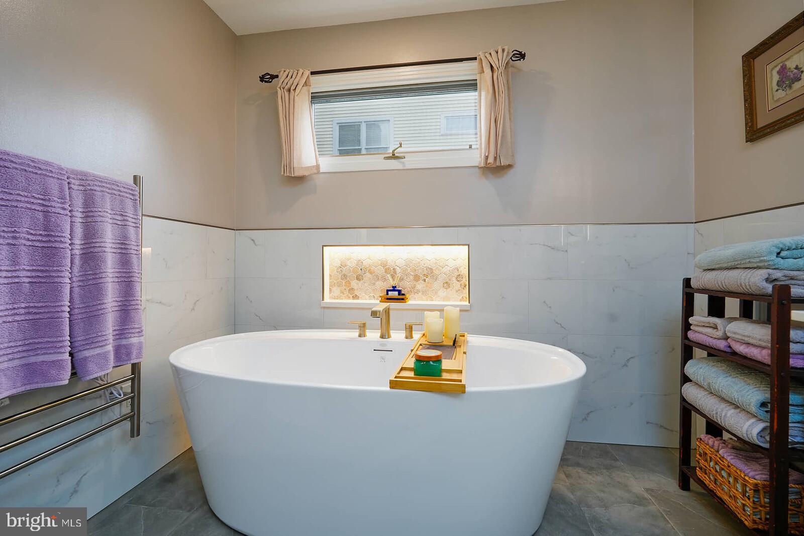 9505 Columbia Boulevard Silver Spring, MD 20910 - Photo 18 of 55 a bath tub sitting in a bathroom next to a sink