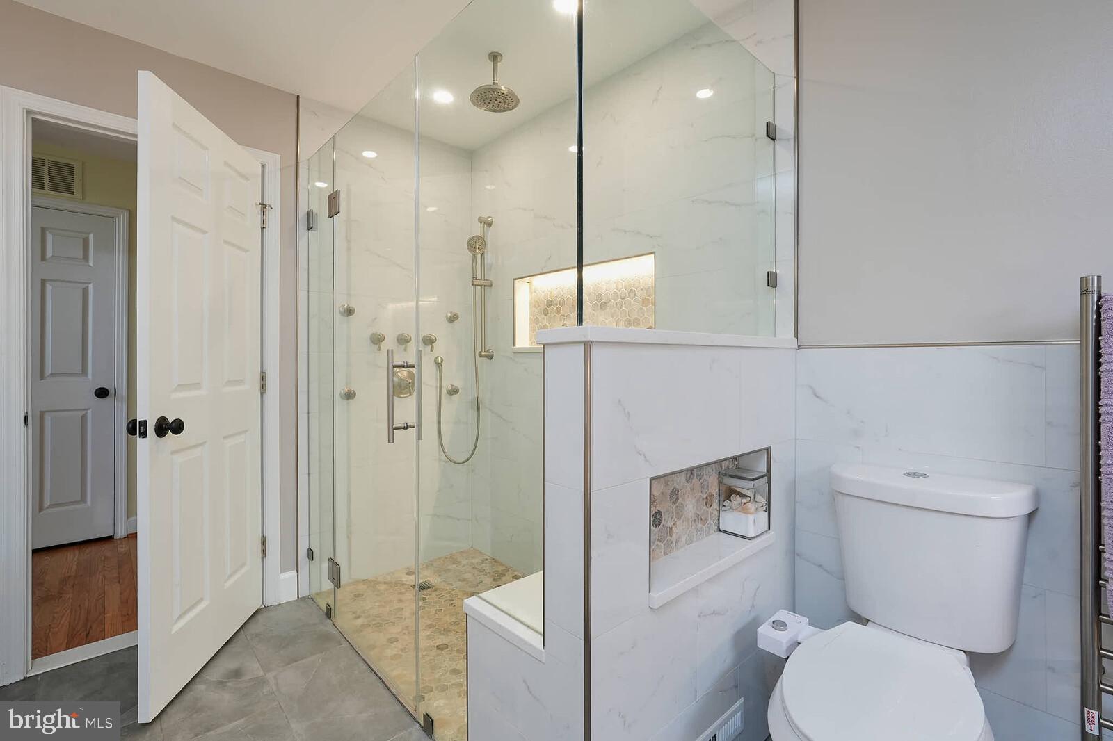 9505 Columbia Boulevard Silver Spring, MD 20910 - Photo 19 of 55 a bathroom with a shower a toilet and sink