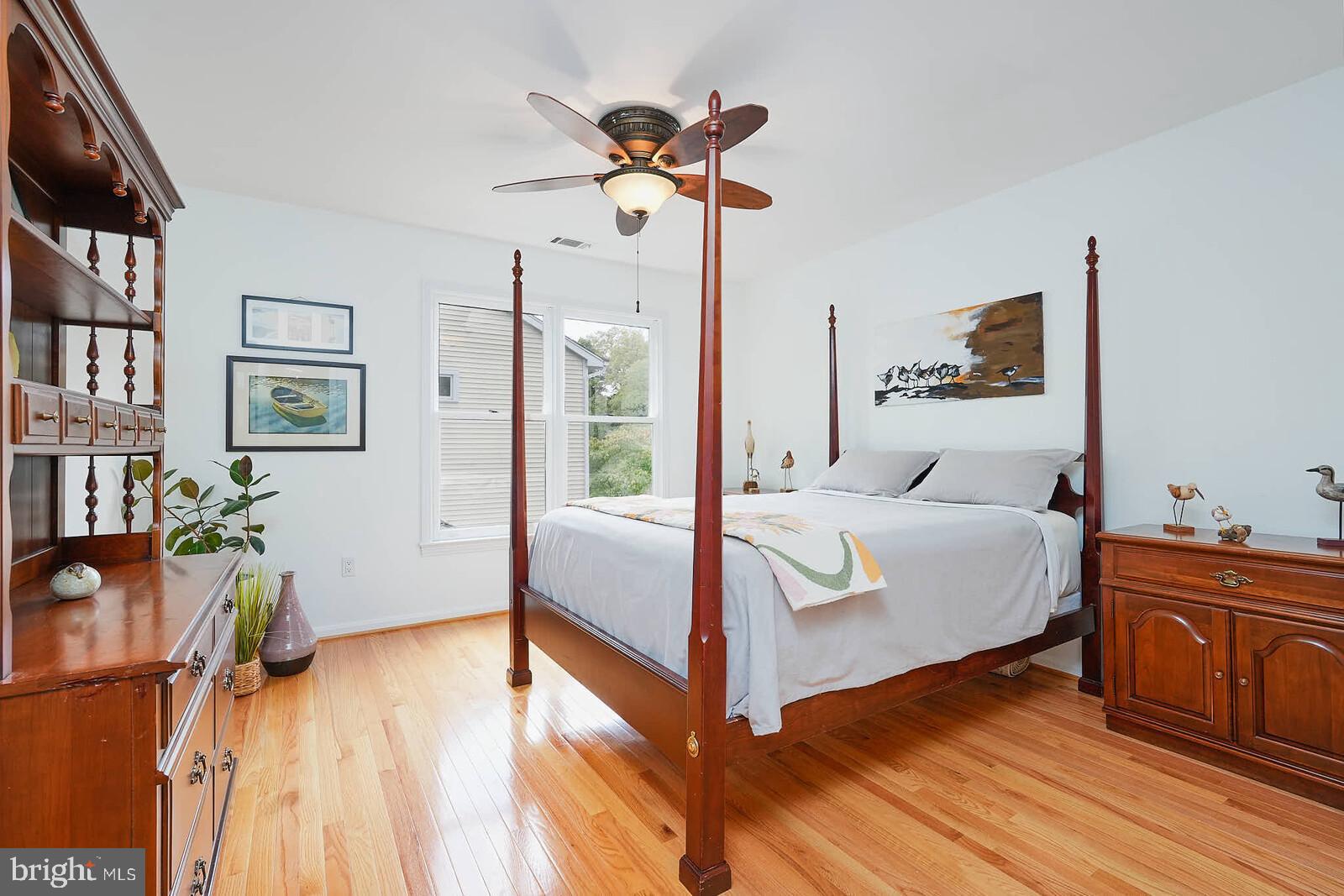 9505 Columbia Boulevard Silver Spring, MD 20910 - Photo 22 of 55 a bedroom with a bed and wooden floor