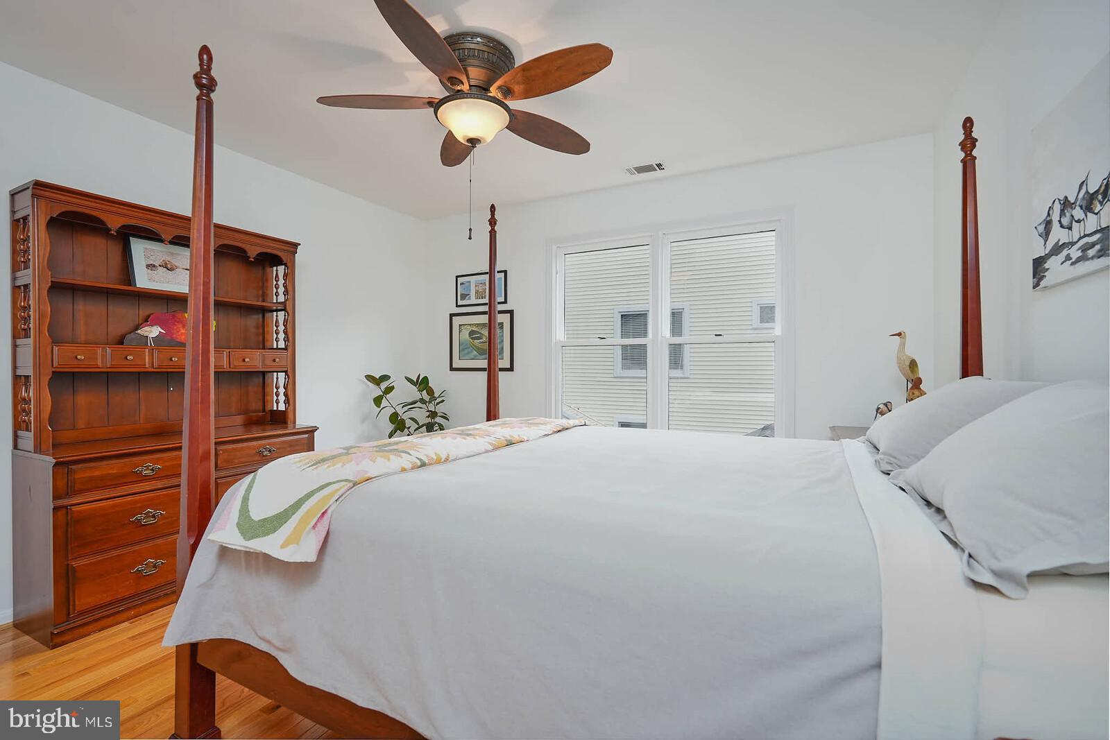 9505 Columbia Boulevard Silver Spring, MD 20910 - Photo 23 of 55 a bedroom with a bed and a chandelier