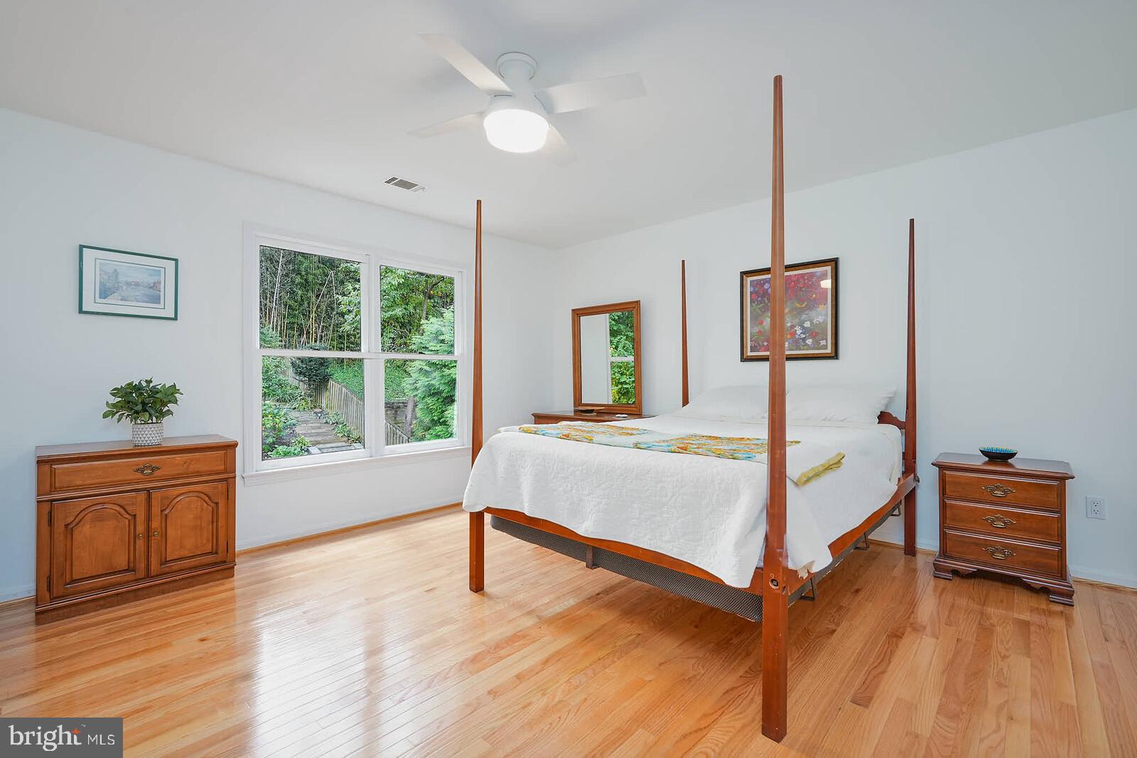 9505 Columbia Boulevard Silver Spring, MD 20910 - Photo 24 of 55 a bedroom with a bed and a window