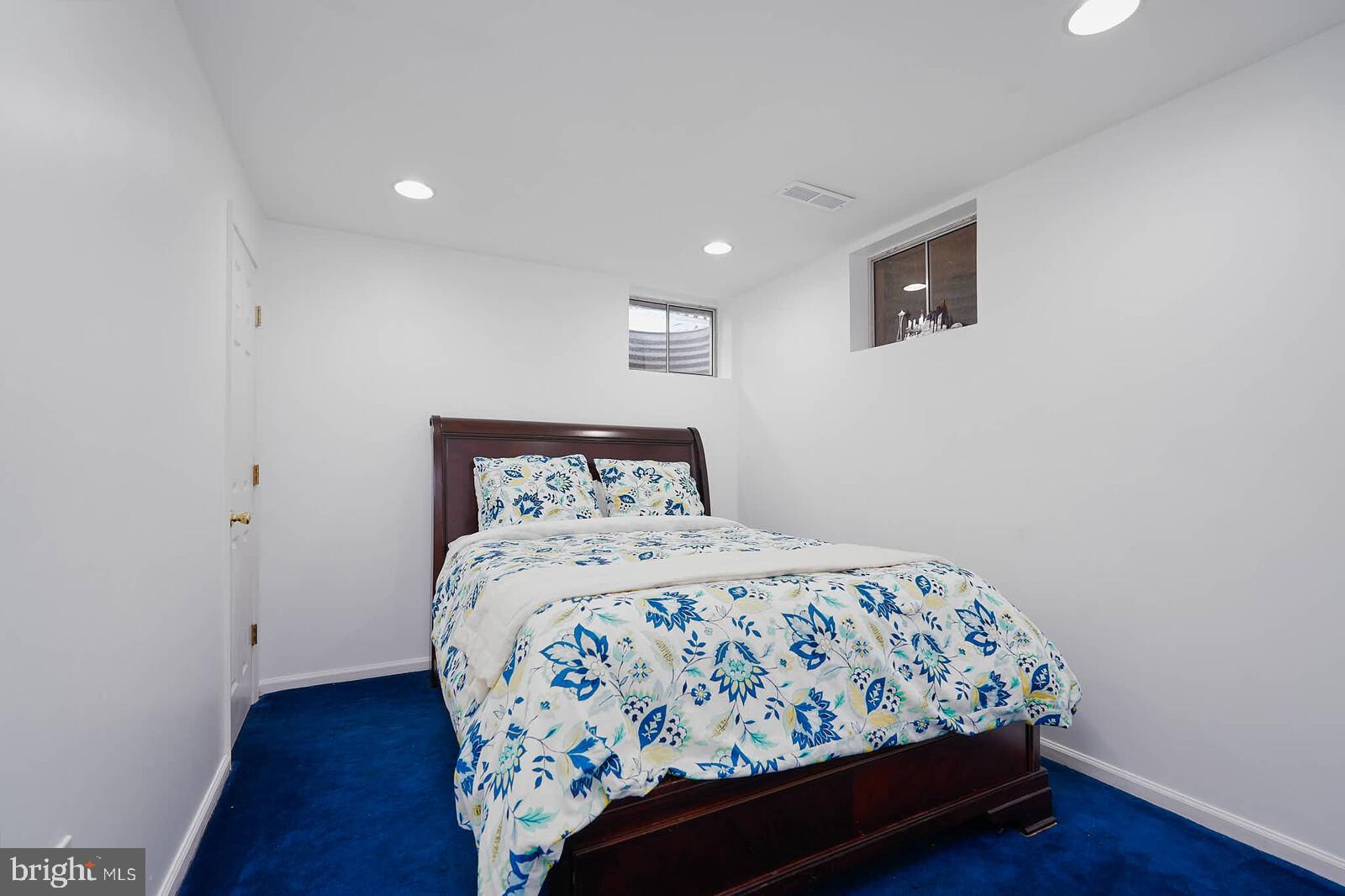 9505 Columbia Boulevard Silver Spring, MD 20910 - Photo 32 of 55 a bedroom with a bed and a night stand