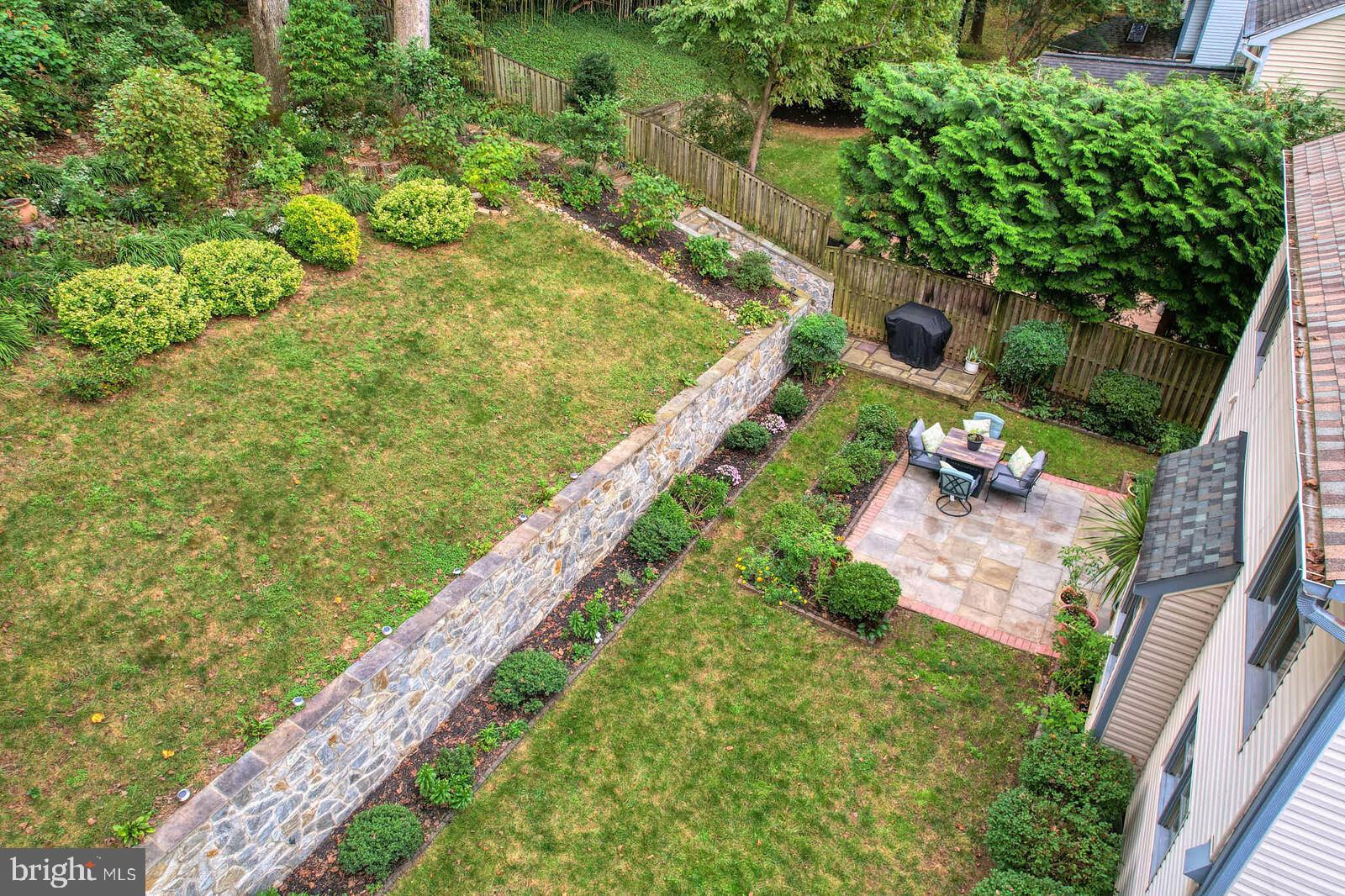 9505 Columbia Boulevard Silver Spring, MD 20910 - Photo 47 of 55 a view of a garden with an outdoor seating