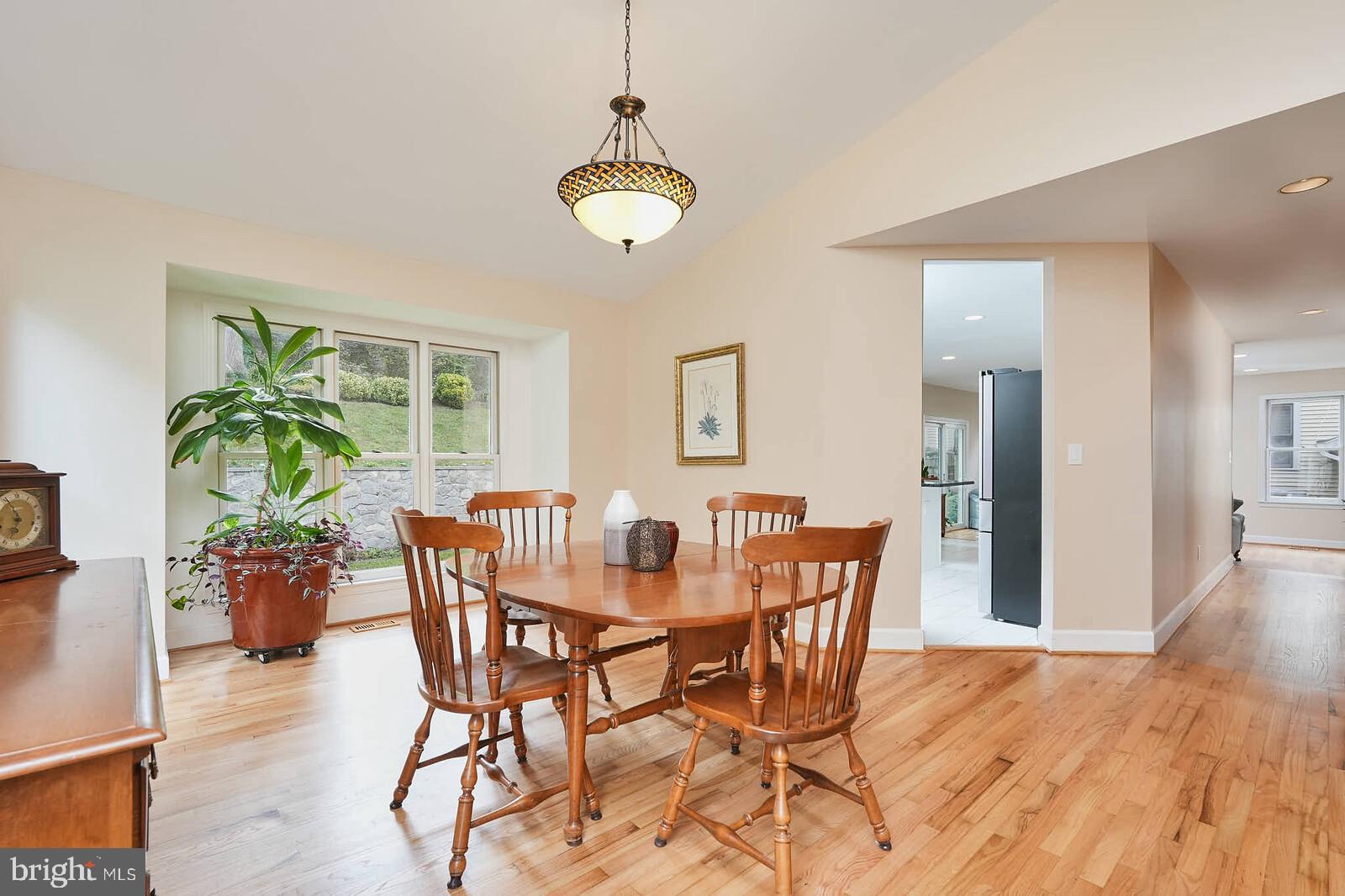 9505 Columbia Boulevard Silver Spring, MD 20910 - Photo 10 of 55 a dining room with furniture potted plants and wooden floor