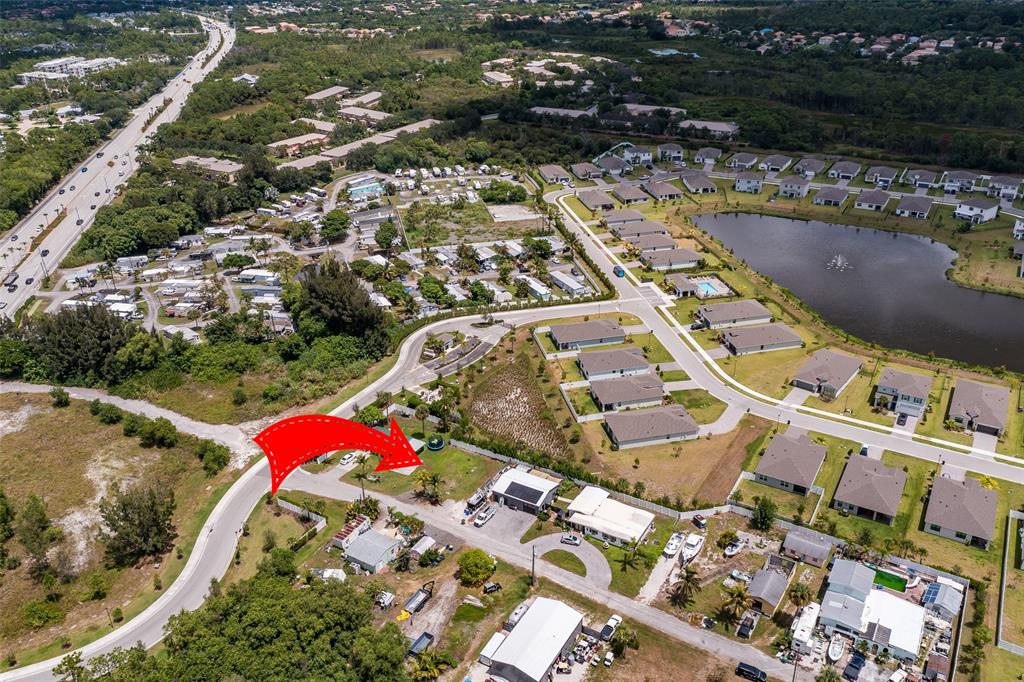 5754 Southeast Green Lane Stuart, FL 34997 - Photo 12 of 16 an aerial view of residential houses with outdoor space
