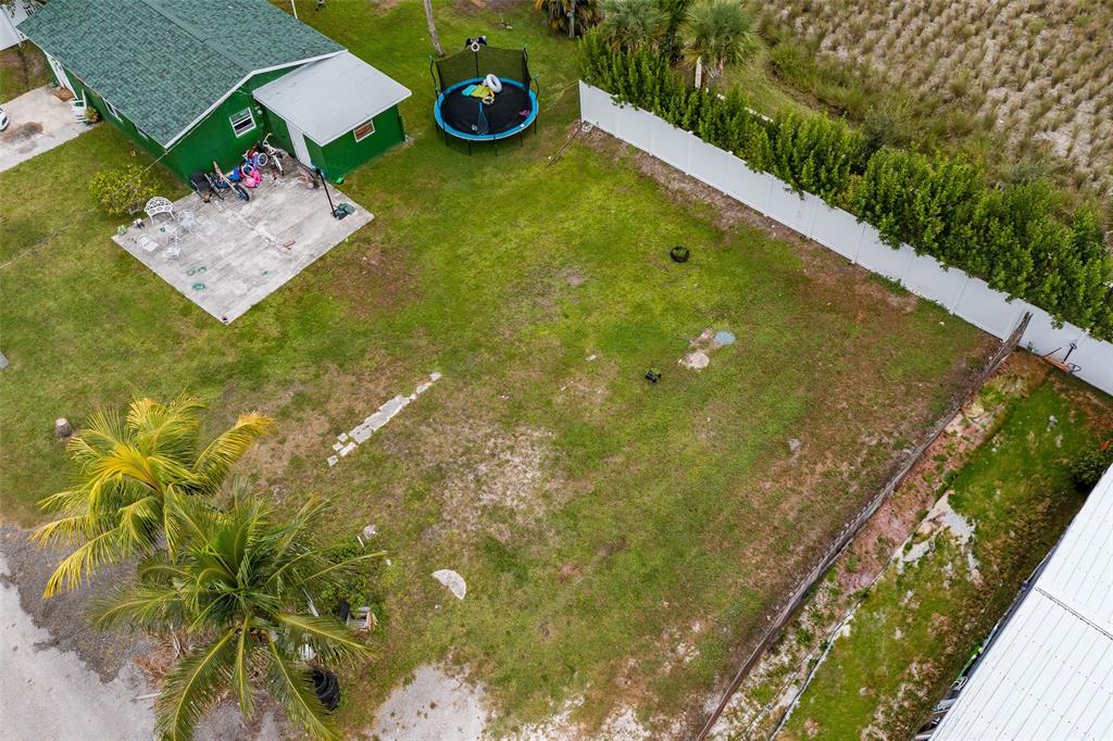 5754 Southeast Green Lane Stuart, FL 34997 - Photo 13 of 16 a view of a back yard of the house