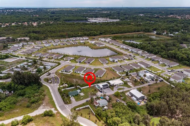 an aerial view of residential houses with outdoor space