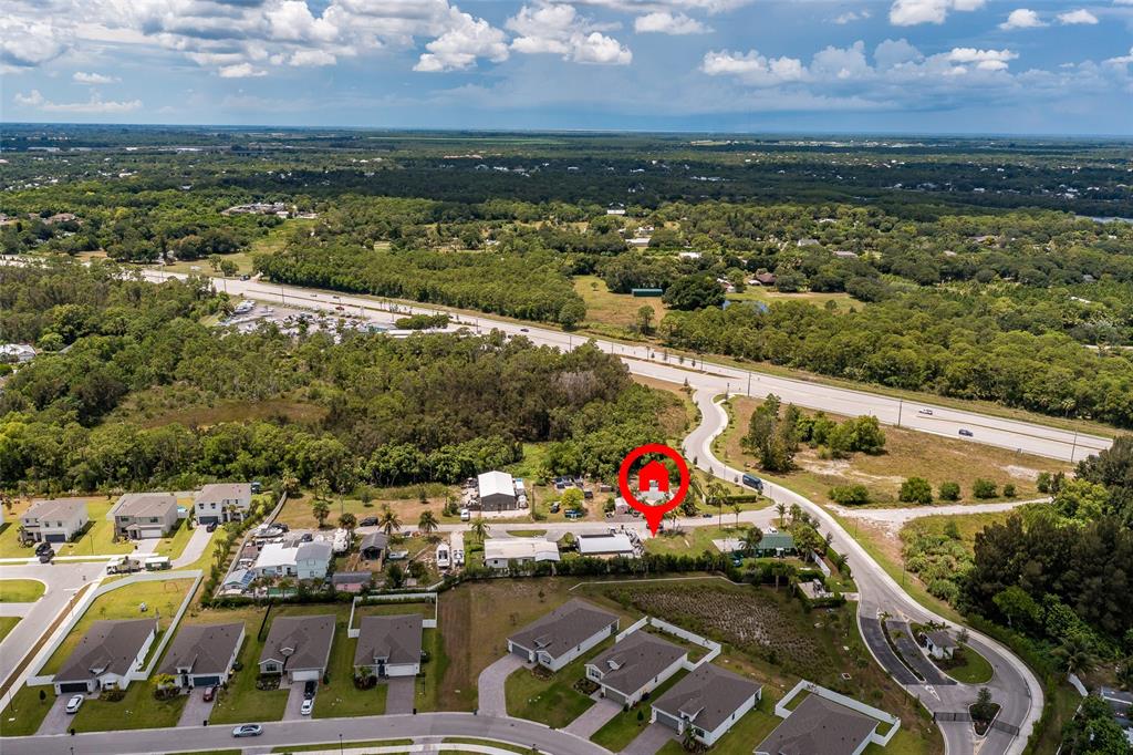 5754 Southeast Green Lane Stuart, FL 34997 - Photo 7 of 16 an aerial view of residential houses with outdoor space