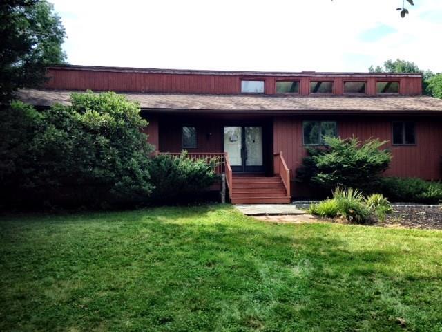 243 Looking Glass Hill Road Morris, CT 06763 - Photo 1 of 1 a view of a house with a yard and plants