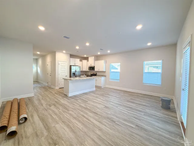 a view of kitchen view with wooden floor