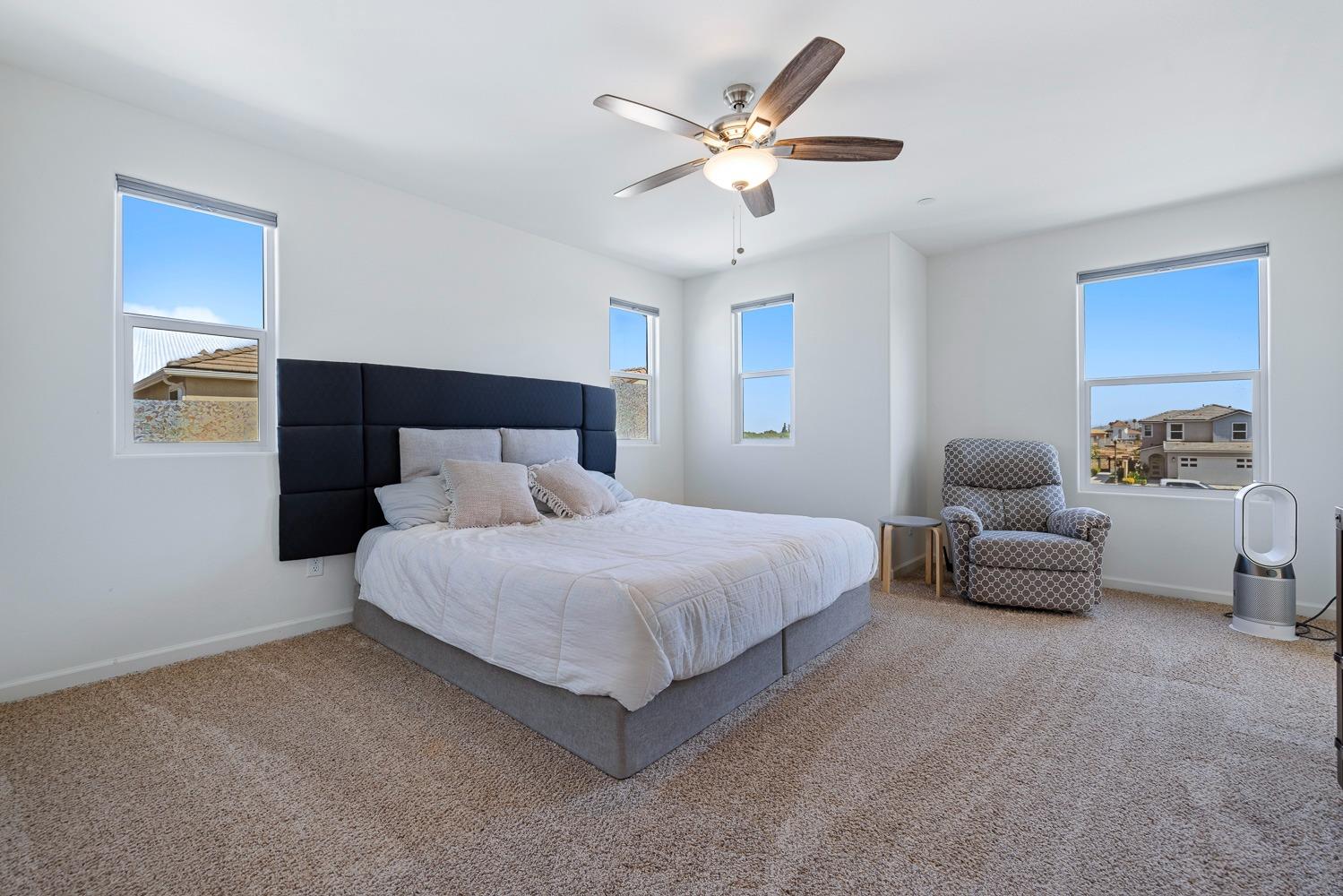 3606 Parkstone Way Clovis, CA 93619 - Photo 20 of 38 a bedroom with a bed couch and window