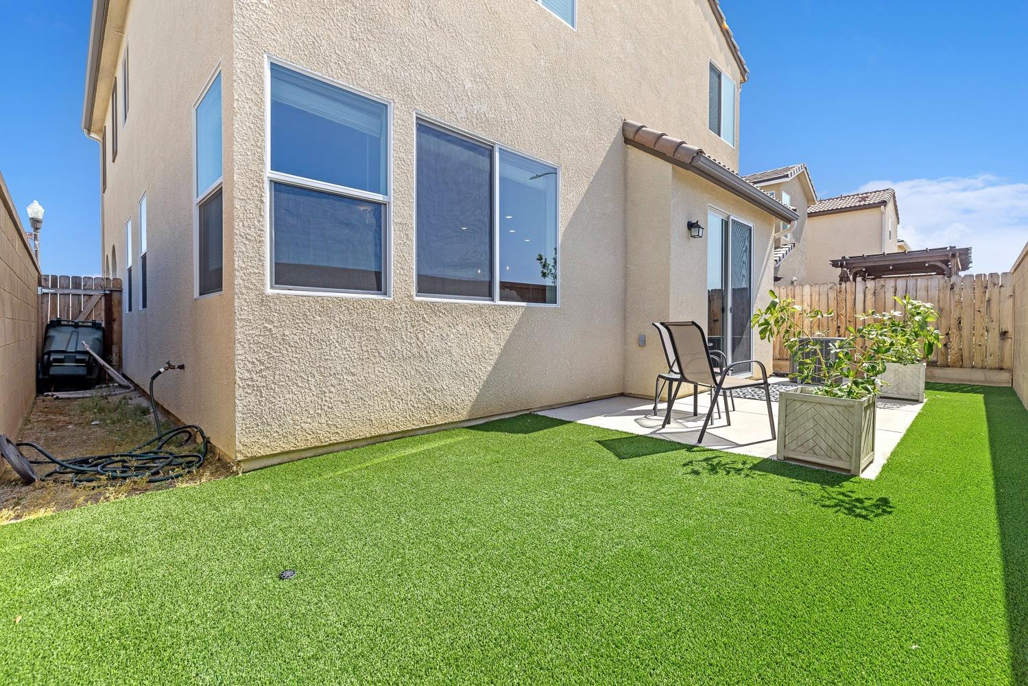 3606 Parkstone Way Clovis, CA 93619 - Photo 33 of 38 a view of an house with backyard and porch