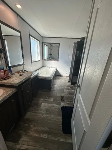 a view of living room with furniture and flat screen tv