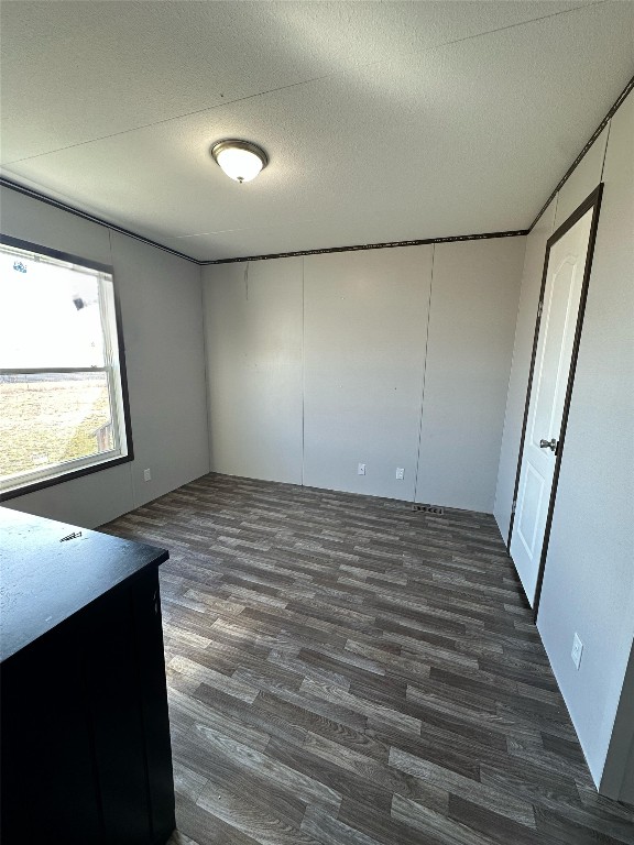 3278 County Road 417 Thorndale, TX 76577 - Photo 20 of 24 an empty room with wooden floor and windows