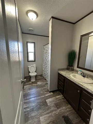 a bathroom with double vanity sink and a mirror